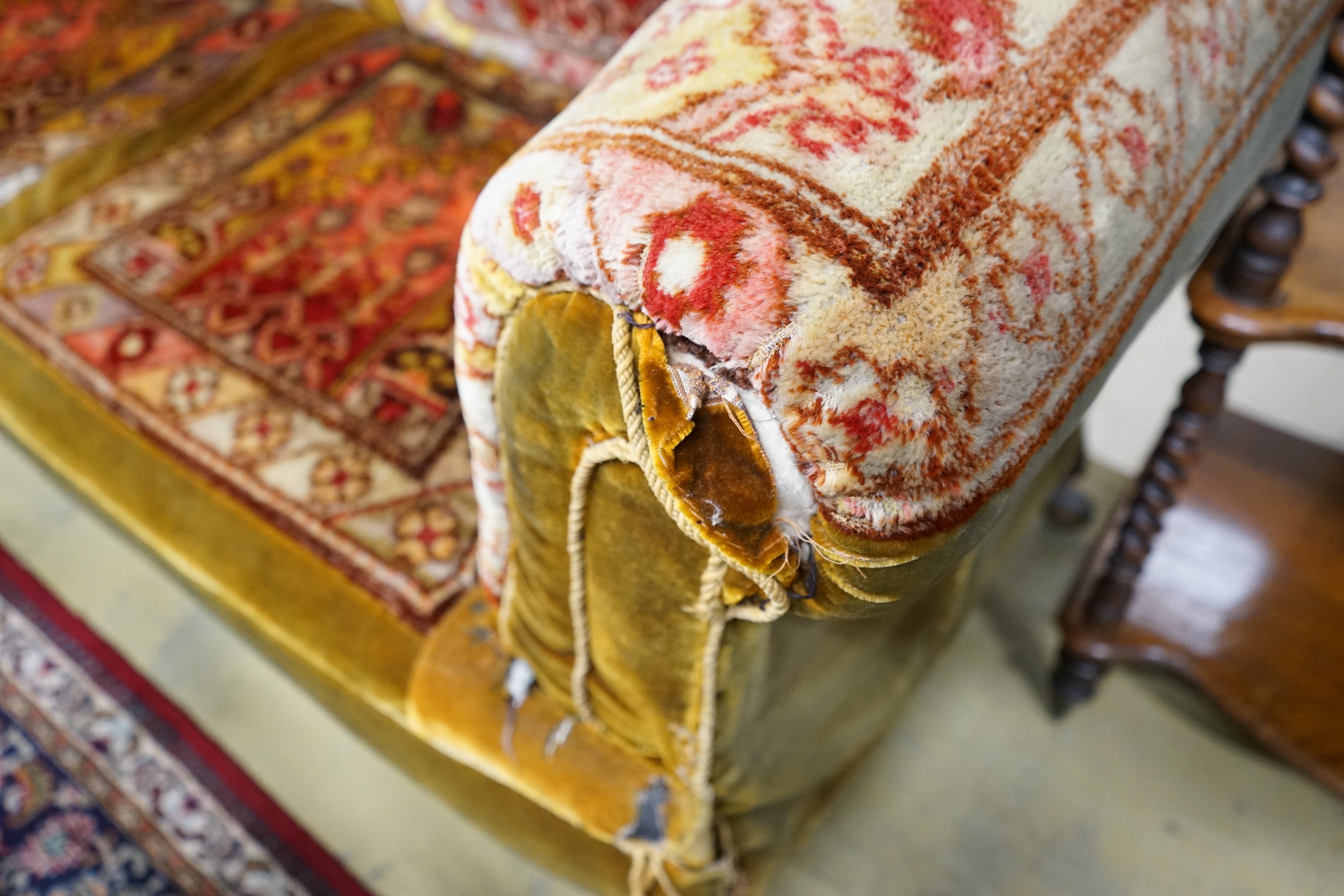 A late Victorian drop arm Chesterfield settee with carpet upholstery, length 175cm, width 78cm, height 80cm